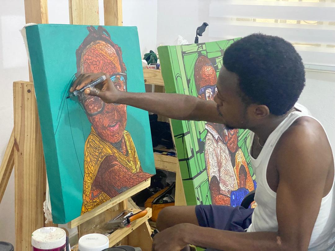 Emmanuel Eweje working on a thread artwork